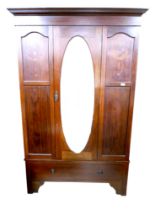 An Edwardian mahogany wardrobe