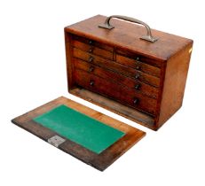 An Edwardian oak collectors cabinet, brass handles