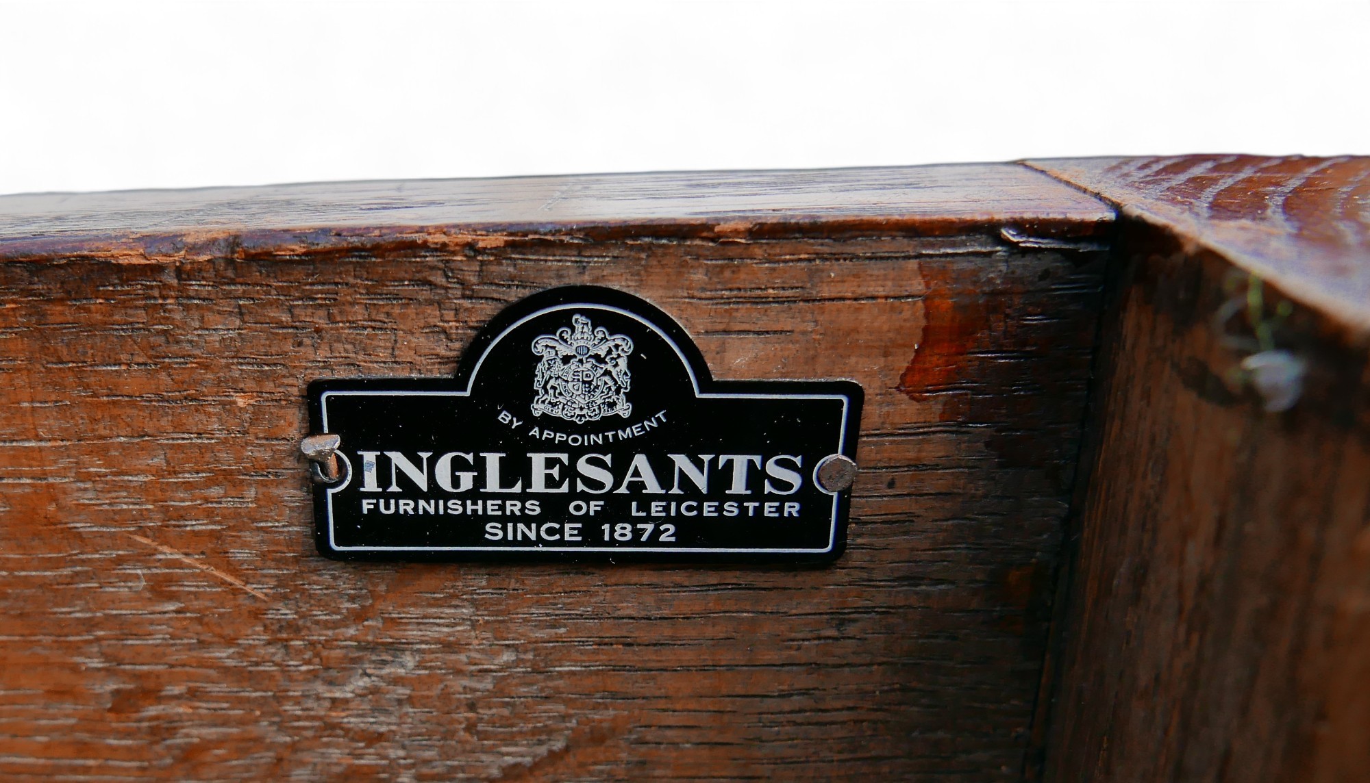 A mid 20th century stained oak chest, labelled 'Inglesants, Furnishers of Leicester', carved arch - Image 6 of 9