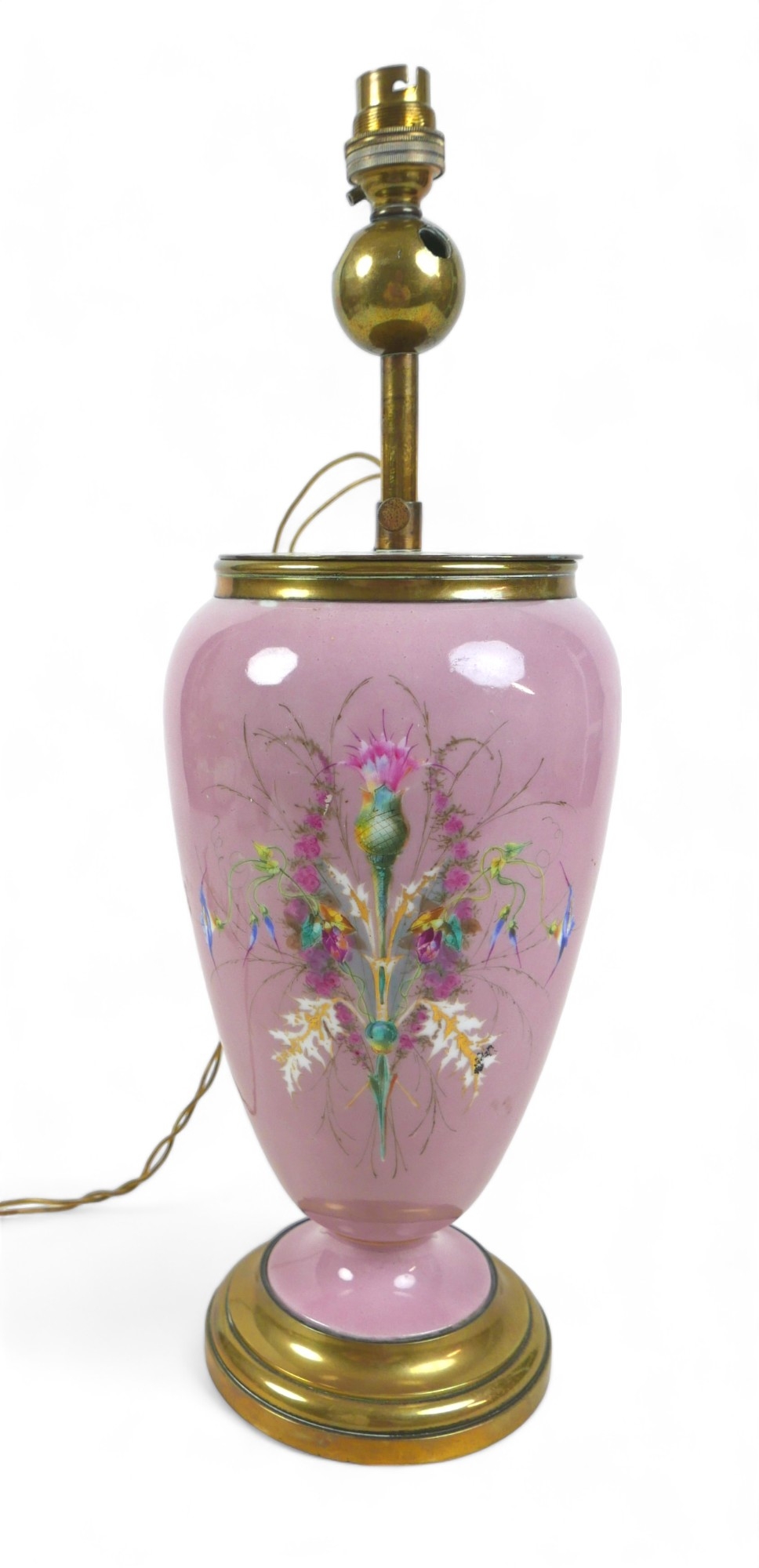 An early 20th century china table lamp, of vase form decorated with a floral spray against a pink