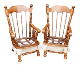 A pair of American Lenoir Chair Company rocking armchairs, in Spanish Colonial style, each 65 by