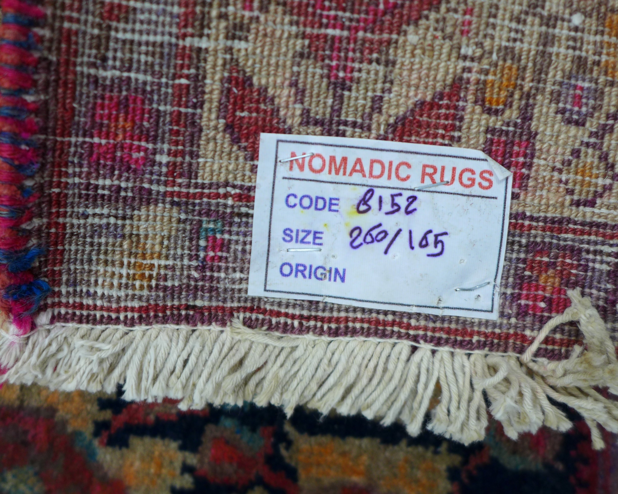 A Hamadan rug, on dark navy ground with repeat pattern to central panel, with large Caucasian border - Image 5 of 5