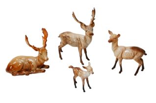 Four Beswick deer figurines, comprising two stags, a doe and a fawn. (4)