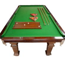 An early 1900s Harrods mahogany snooker dining table