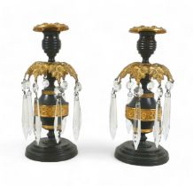 A pair of 19th century bronze and gilt metal candlesticks