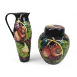 Two pieces of Moorcroft pottery, comprising a large lidded ginger jar with figs, peaches and