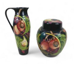 Two pieces of Moorcroft pottery, comprising a large lidded ginger jar with figs, peaches and