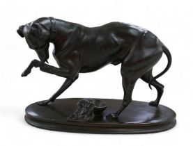 A 19th century spelter sculpture, of a greyhound licking its injured paw, signed 'A. Vogt' to oval