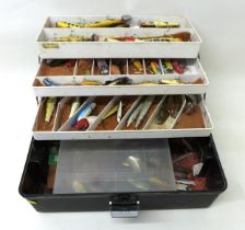 A collection of spoon and bait fishing lures, approximately 50 in total, contained in a folding