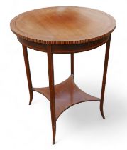 An Edwardian inlaid mahogany occasional side table with an undertier, 59cm diameter by 72cm tall.