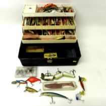 A collection of spoon and bait fishing lures, approximately 50 in total, contained in a folding