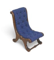 A Victorian small mahogany nursing chair, with blue button back upholstery, scrolling supports