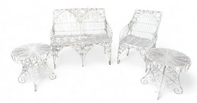 A white metal garden seat, chair, and two small matching tables, all with quatrefoil details. (4)
