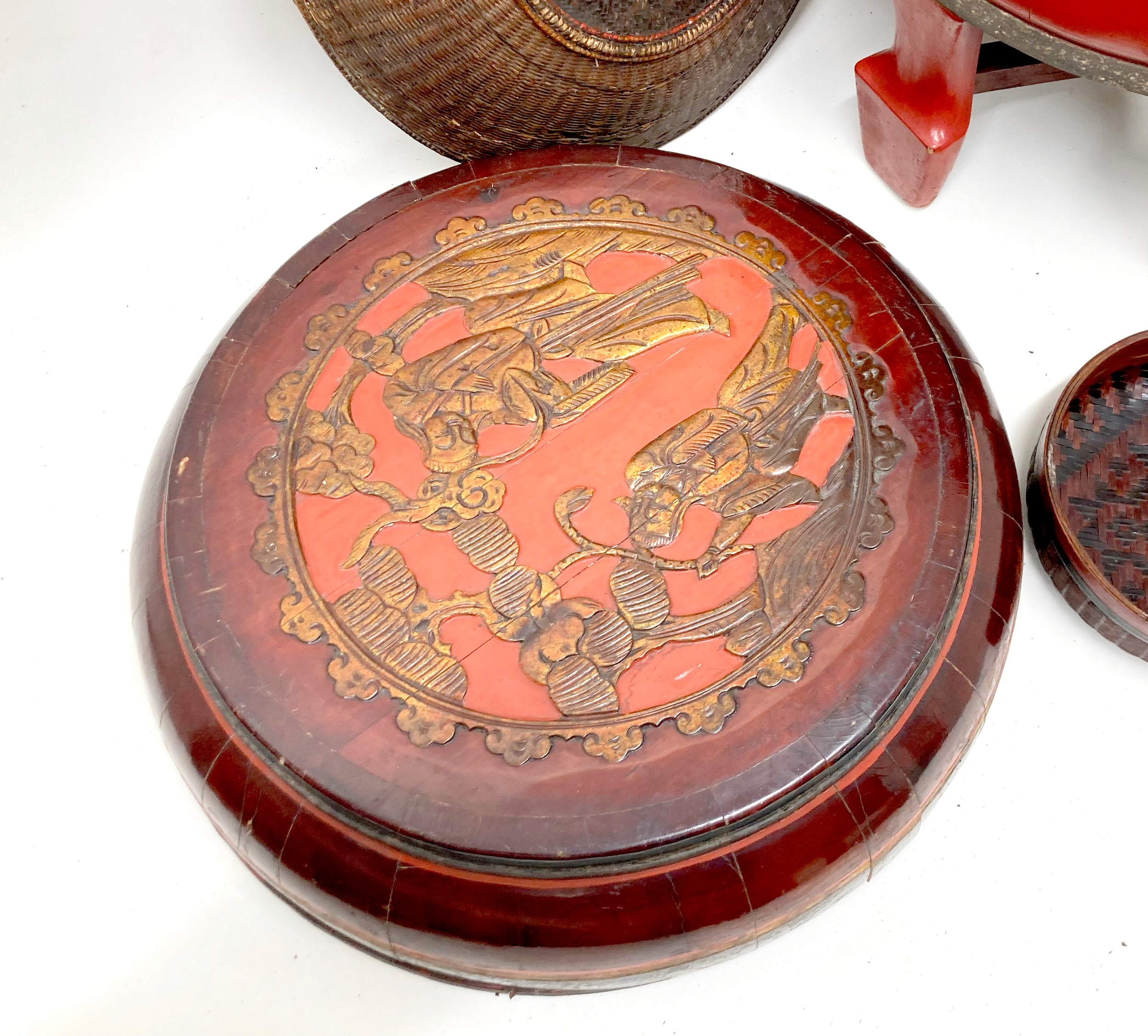 A collection of eight Chinese wooden and rattan bowls, the largest painted red and raised on four - Image 6 of 7
