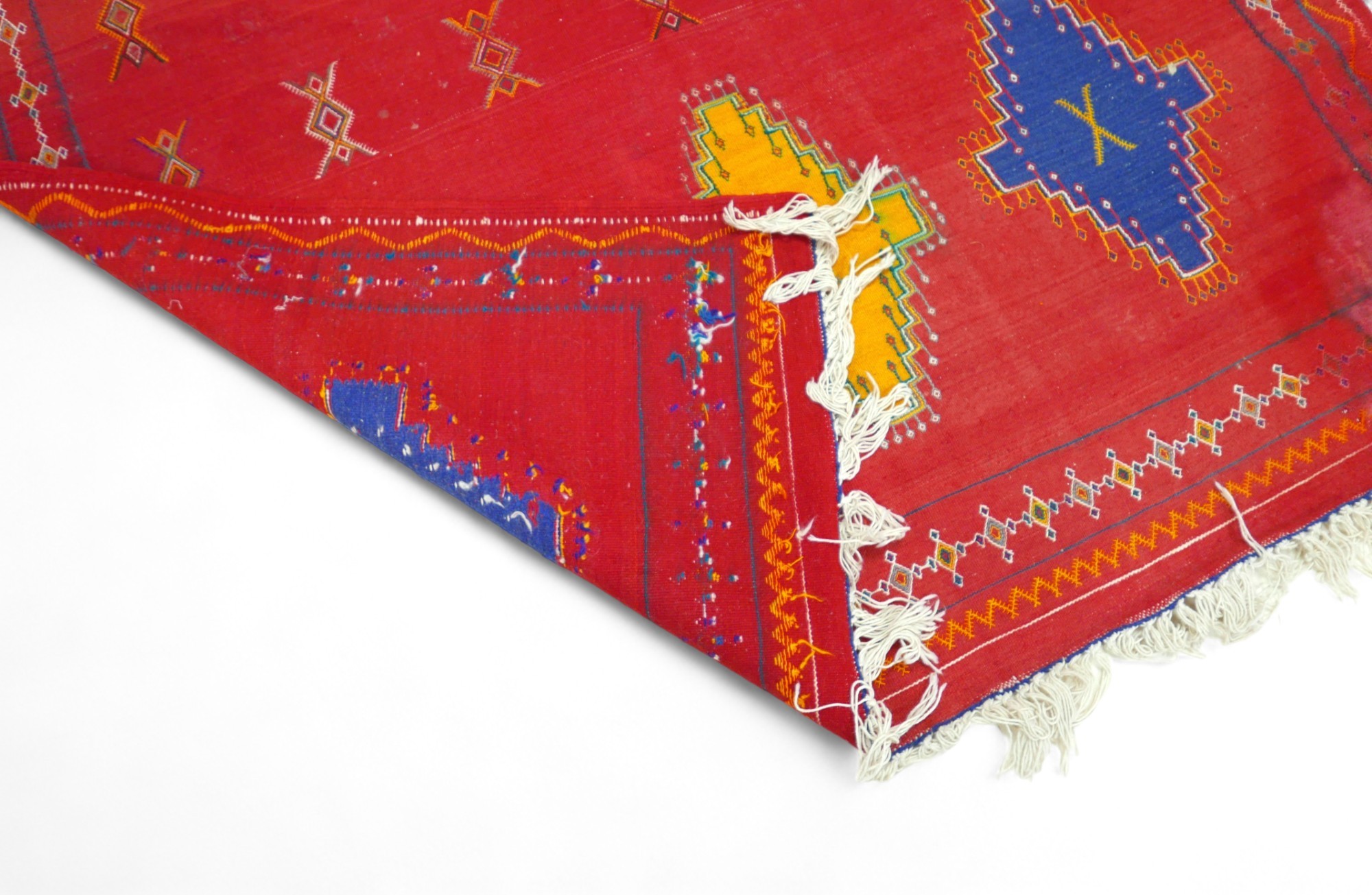 A Moroccan kilim rug, on red ground with traditional Berber symbols and blue and yellow - Image 2 of 5