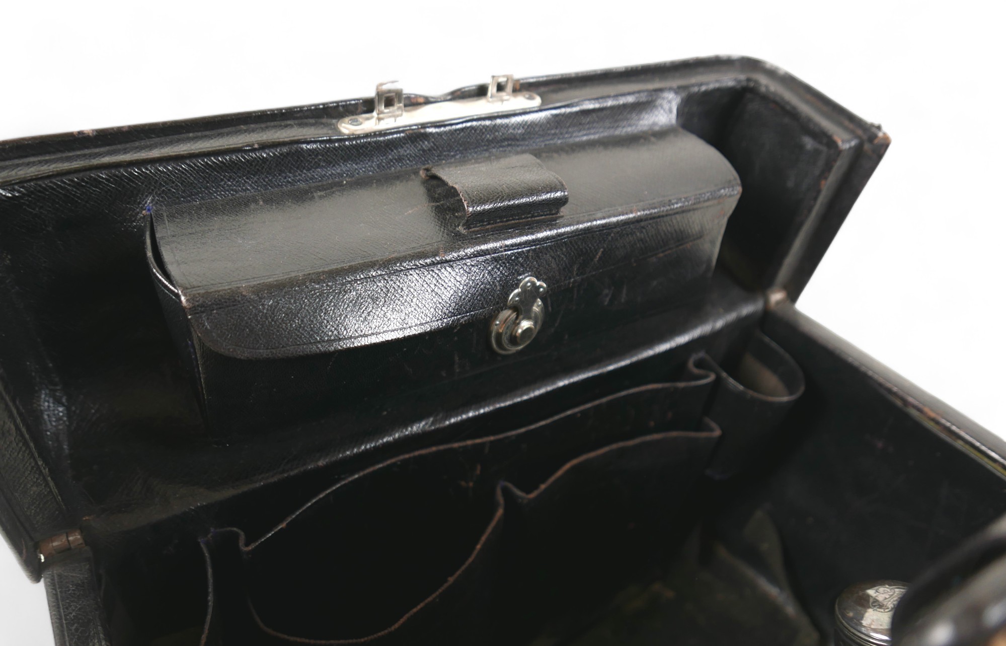 A late Victorian leather fitted travel case with a fitted interior housing bottles and brushes, with - Image 6 of 14