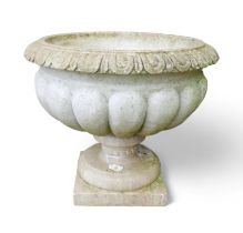 A lobed marble urn / planter on square base, egg and dart rim.