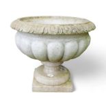 A lobed marble urn / planter on square base, egg and dart rim.