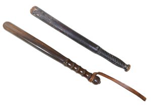 Two British Police truncheons, comprising a Victorian painted truncheon, 43cm long together with a