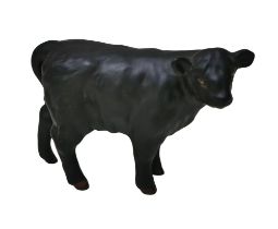 A Beswick figurine of an Aberdeen Angus calf model 1827A, in matt finish, 7.5cm high.