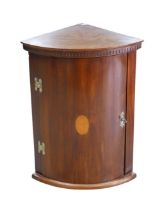 A 19th century mahogany and inlaid bow fronted corner cabinet, with single interior shelf, 36 by