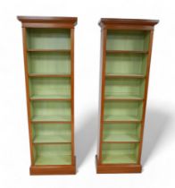 A pair of full new height walnut bookcases with painted interior and five adjustable shelves, 56.5cm