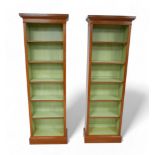 A pair of full new height walnut bookcases with painted interior and five adjustable shelves, 56.5cm