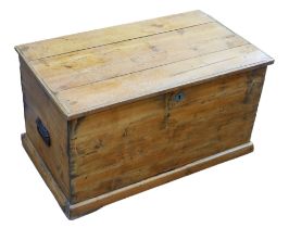 A 20th century pine blanket box, hinged lidded top and with twin metal handles, 81 by 47 by 45cm