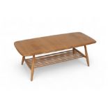 An Ercol blonde elm coffee table with an undertier, model 459, 105 by 46 by 36.5cm. good condition