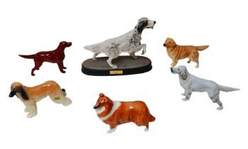 Six Beswick figurines of dogs, including 'The Setter' raised upon a plinth, 22.5cm high. (6)