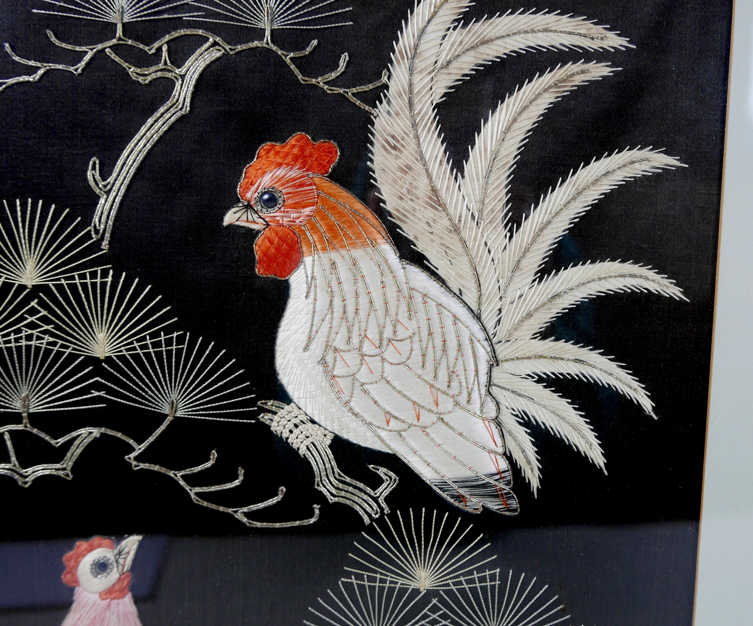 A pair of Asian embroidered panels, depicting exotic birds on a black ground, 49 by 39cm, each - Image 3 of 7