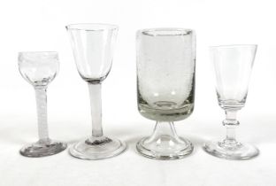 Four 18th century drinking glasses including an air twist cordial glass, largest 7.5cm diameter 16cm