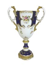 An Edwardian Coalport porcelain goblet-vase, shape 144, modelled with three handles, flared rim,