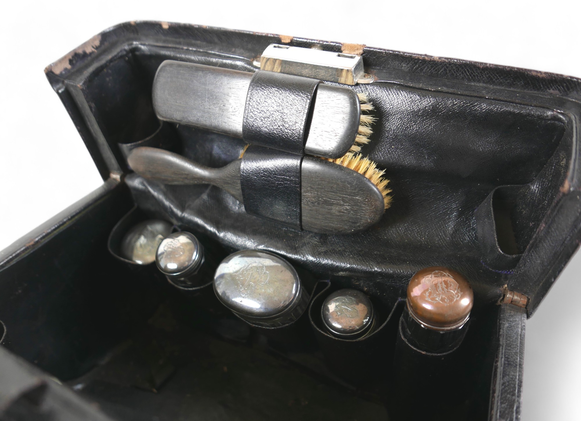 A late Victorian leather fitted travel case with a fitted interior housing bottles and brushes, with - Image 5 of 14