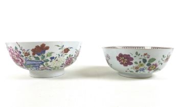 Two 18th century famille rose bowls, 26cm by 11.5cm tall and 23cm by 9.5cm Larger bowl has riveted