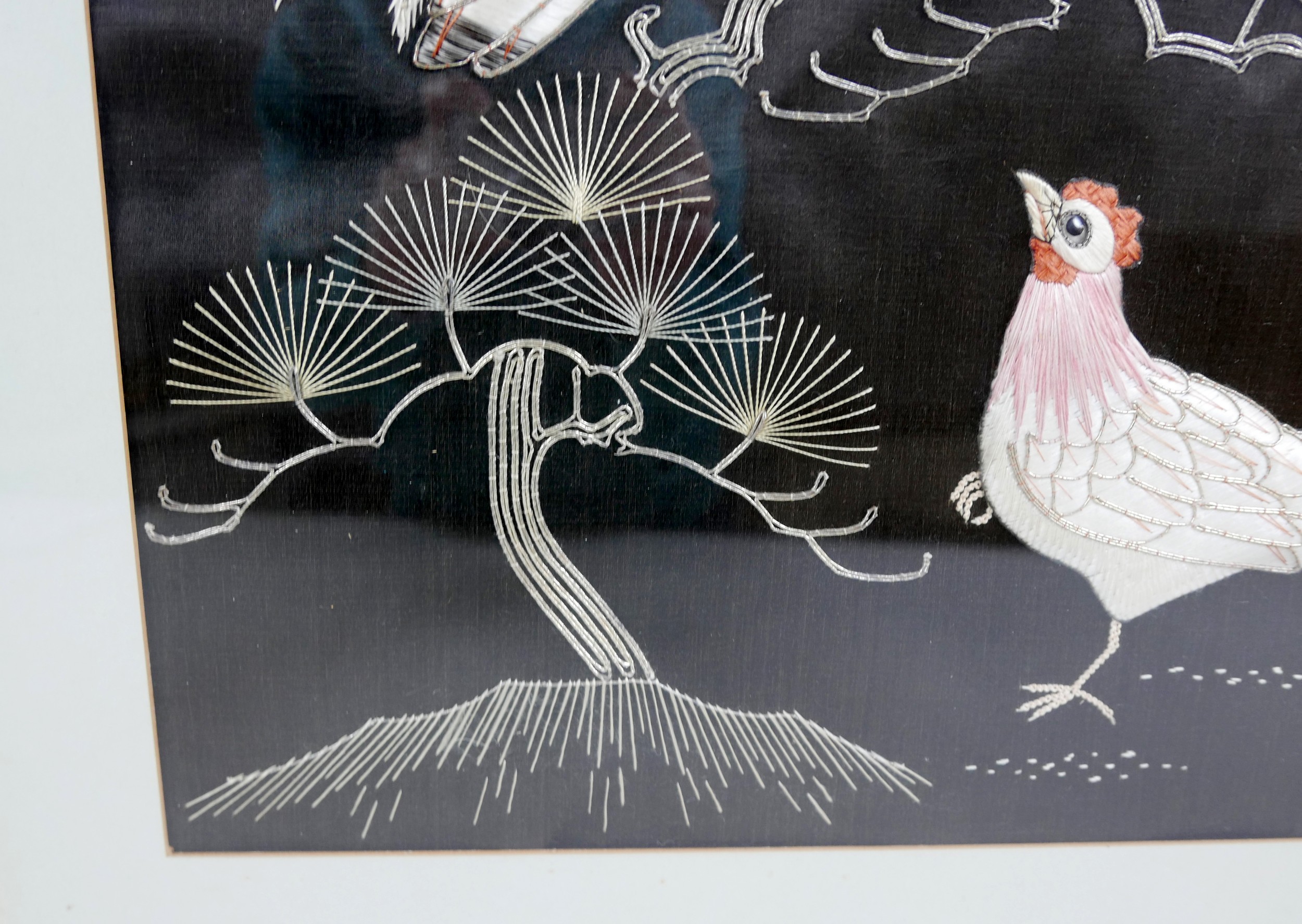 A pair of Asian embroidered panels, depicting exotic birds on a black ground, 49 by 39cm, each - Image 4 of 7
