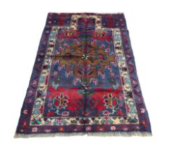 Blue and red 100% hand knotted woollen carpet rug, 124 by 80cm.