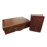 A good quality early 1900's tan leather suitcase with a crown and initialled WWN, part fittings,