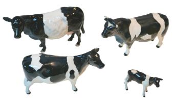 Four Beswick cattle figurines, comprising three Fresian cattle figurines, a 'Coddington Hilt. Bar'