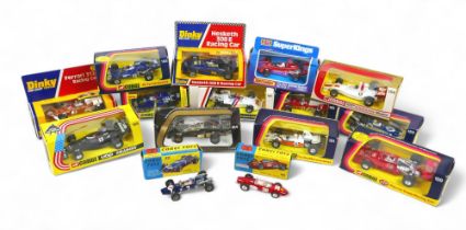 A collection of fifteen die cast racing cars to include Dinky, Corgi and Matchbox. All boxed.