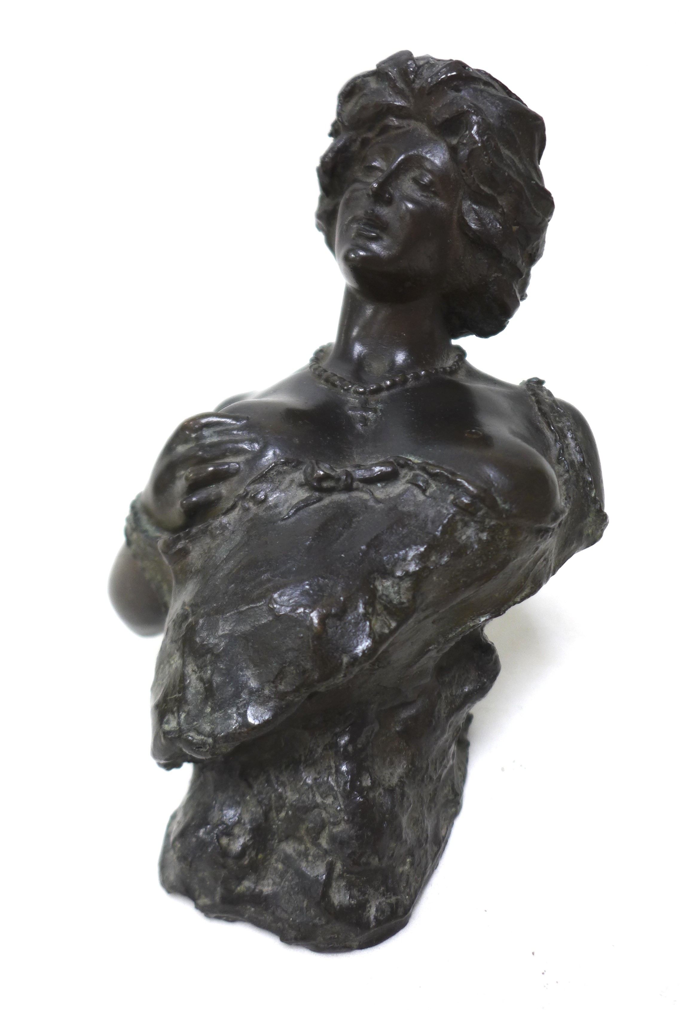Giuseppe Renda (Italian, 1859-1939): 'Woman exposing her breast', a bronze sculpture, signed 'G