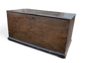 A 19th century oak chest, with metal hinges.