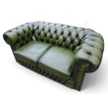 A modern green leather button back Chesterfield sofa, 153cm by 87cm by 72cm tall.