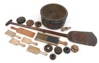 A collection of bygones comprising butter pats, cog moulds, metal bound part barrel and a wooden