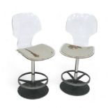 A pair of clear Perspex vintage bar stools, leather seats a/f, with black circular bases, 43.5 by 49