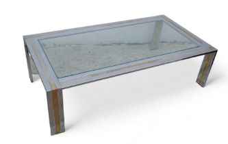 A chrome / silvered metal and brass coffee table with clear glass inset