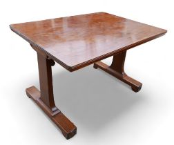 A mahogany library table, with a rectangular top on twin supports having platform bases, 115 by 74