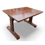 A mahogany library table, with a rectangular top on twin supports having platform bases, 115 by 74