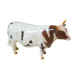 A Beswick Ayreshire Bull figurine, 'Ch. Whitehill Mandate' to its base.