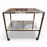 A rectangular glass topped two-tier trolley with silver / brass edge.